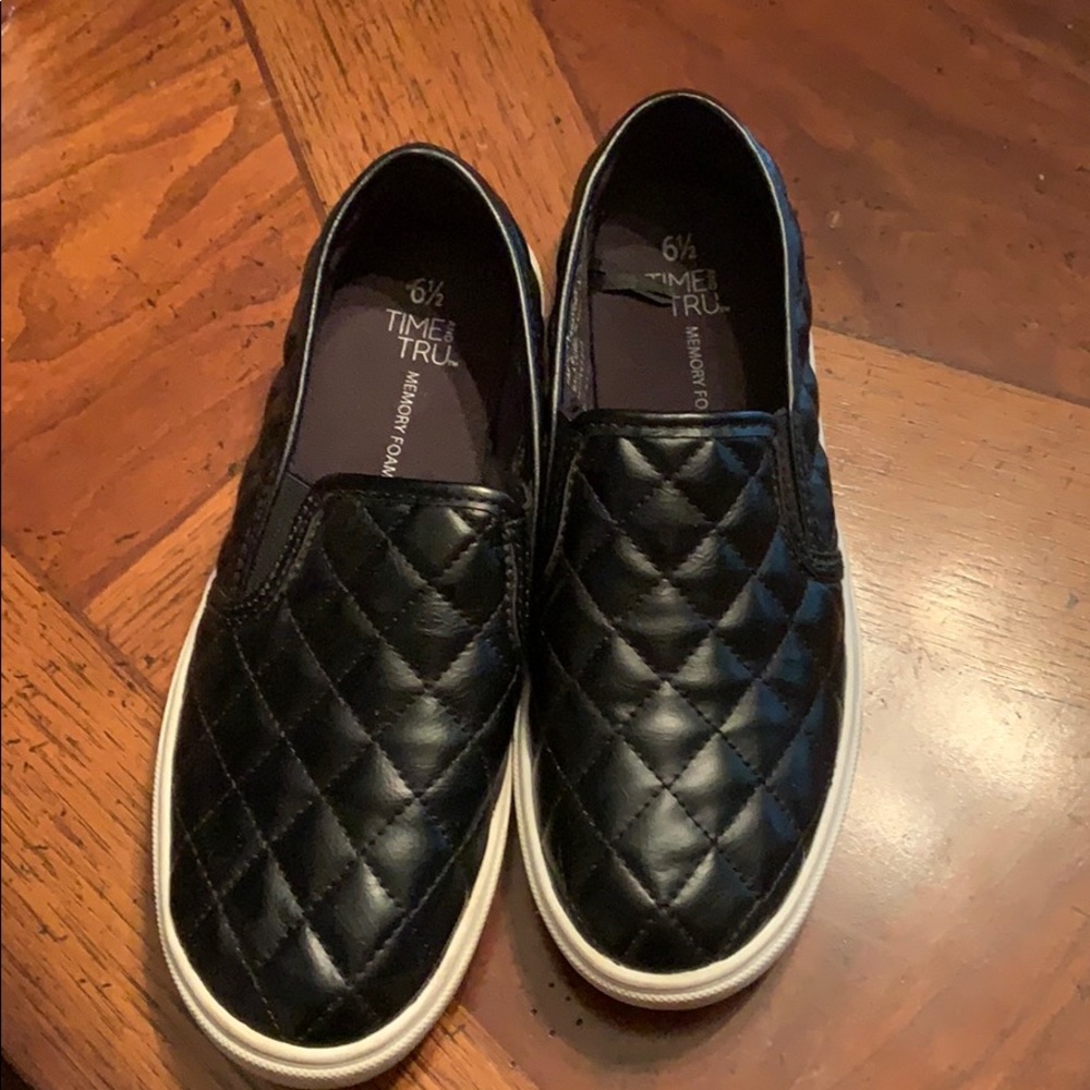 Slip on shoes slightly worn .